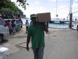 Image #28 - Hurricane Tomas Relief Effort (Carrying the goods to the distribution point)